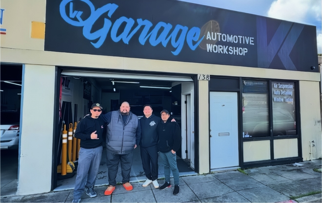 VK Garage automotive workshop storefront and team
